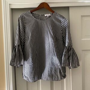 Calvin Klein black and white checked blouse.